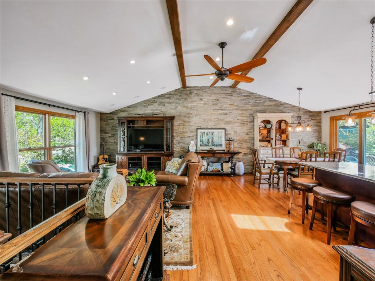 333 Rugby Place Schaumburg, IL 60169 - Photo 3 of 34 a living room with furniture flat screen tv and a large window