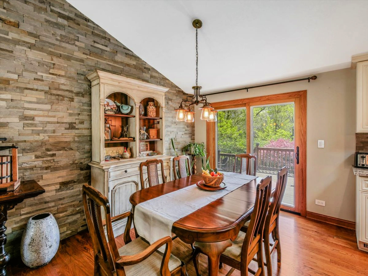333 Rugby Place Schaumburg, IL 60169 - Photo 6 of 34 a view of a dining room with furniture window and wooden floor