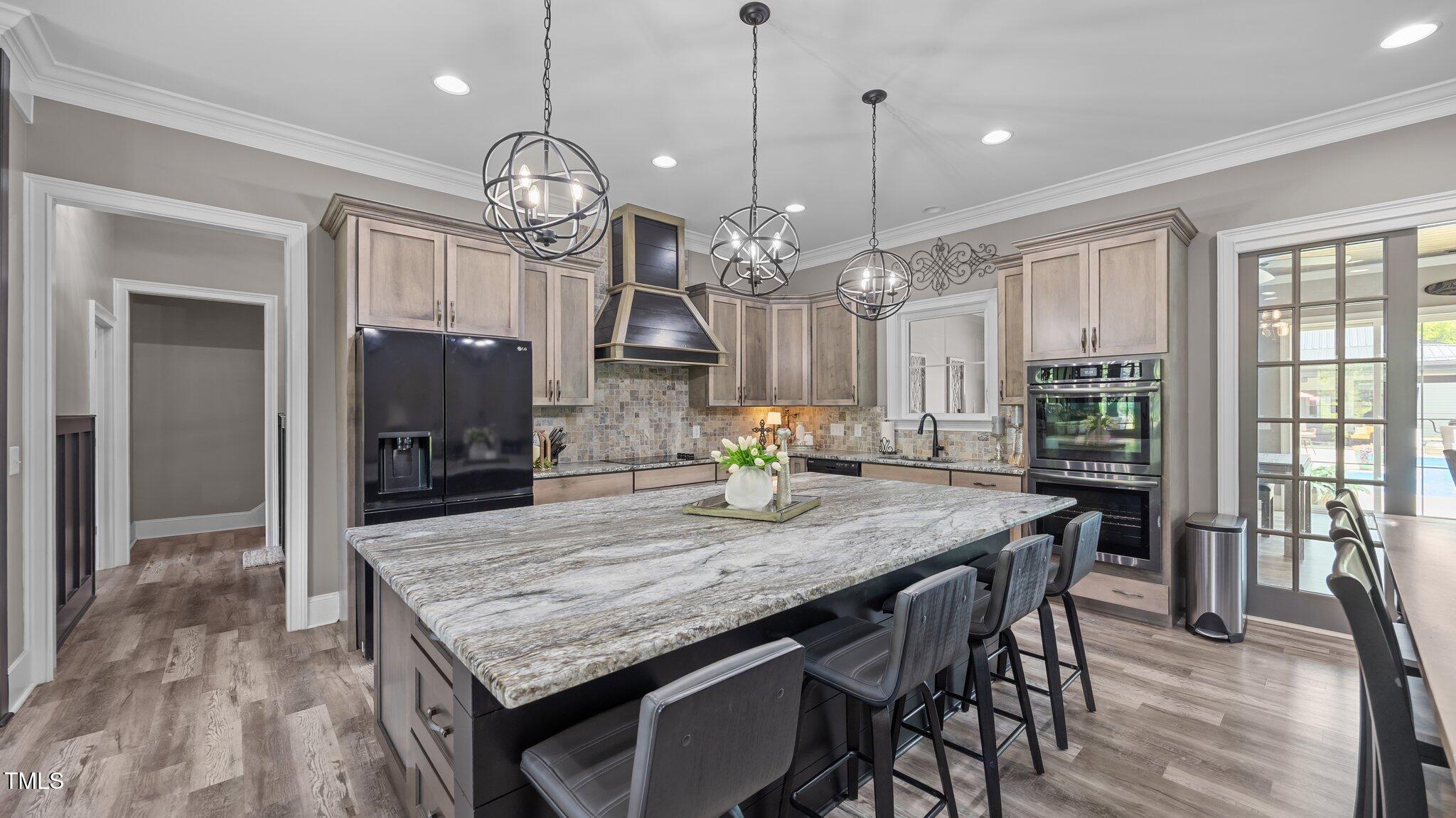 4152 Boyd Wright Road Burlington, NC 27215 - Photo 18 of 65 Oversized island with bar seating.
