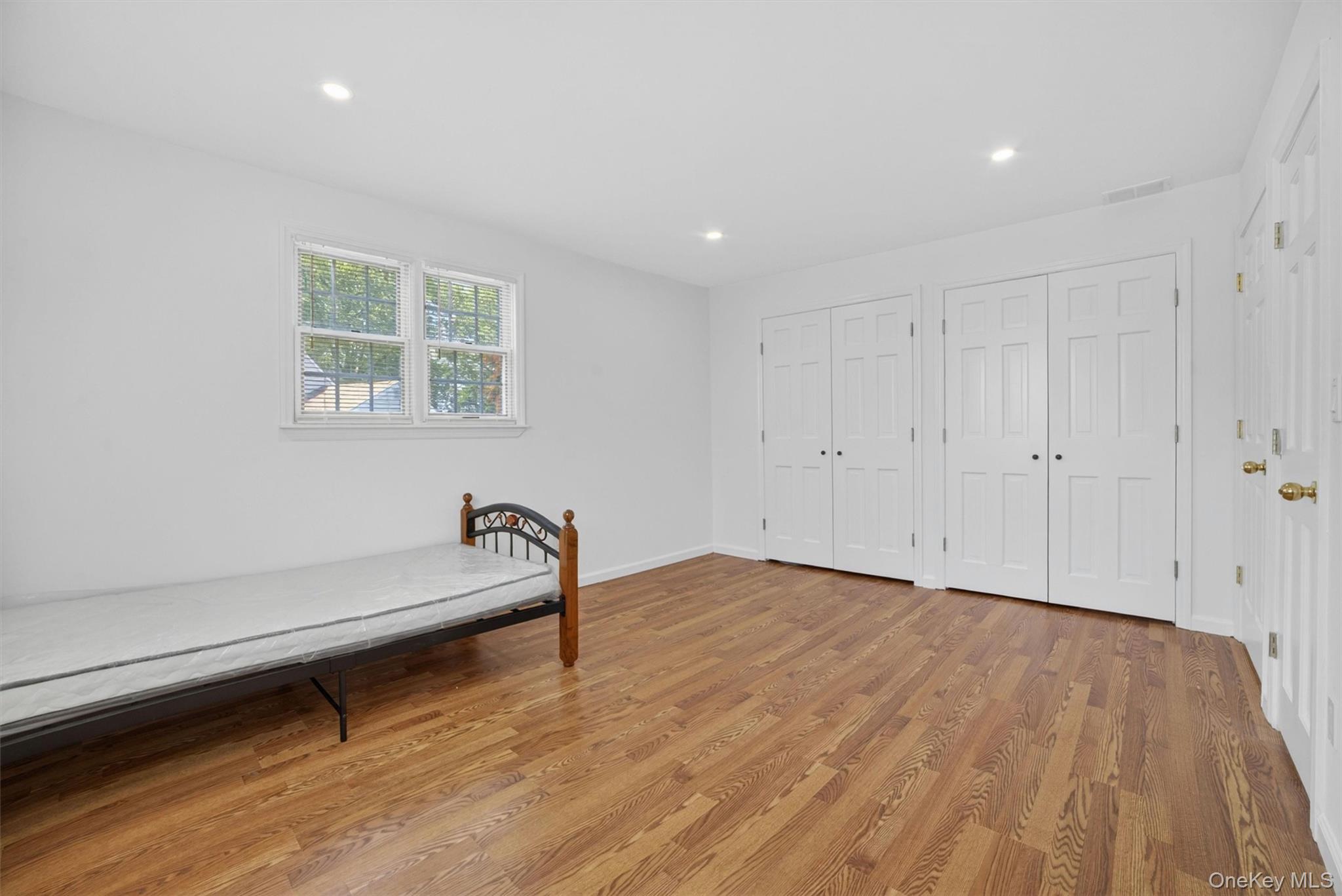 263 Croydon Road Yonkers, NY 10710 - Photo 18 of 43 a view of room with hardwood floor and windows
