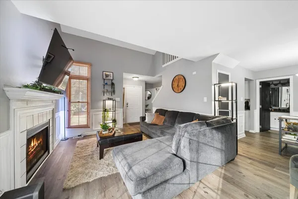 a living room with furniture and a fireplace