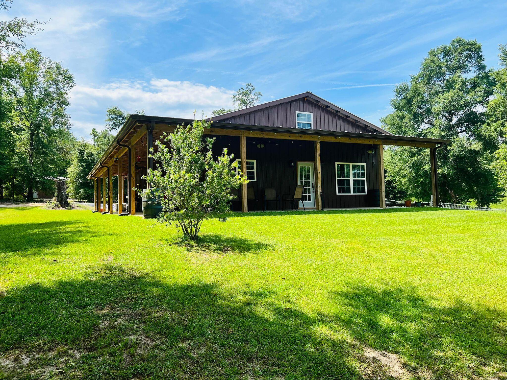 a front view of house with yard and green space