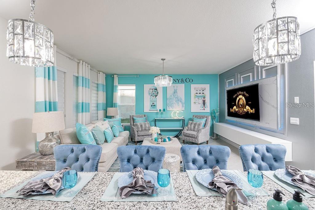 2937 Hooded Crane Cove Harmony, FL 34773 - Photo 15 of 58 a living room with furniture a fireplace and a chandelier