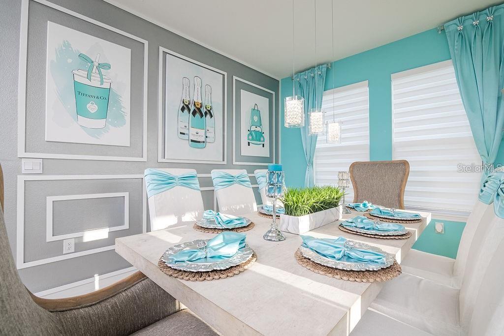 2937 Hooded Crane Cove Harmony, FL 34773 - Photo 23 of 58 a dining room with furniture and a table