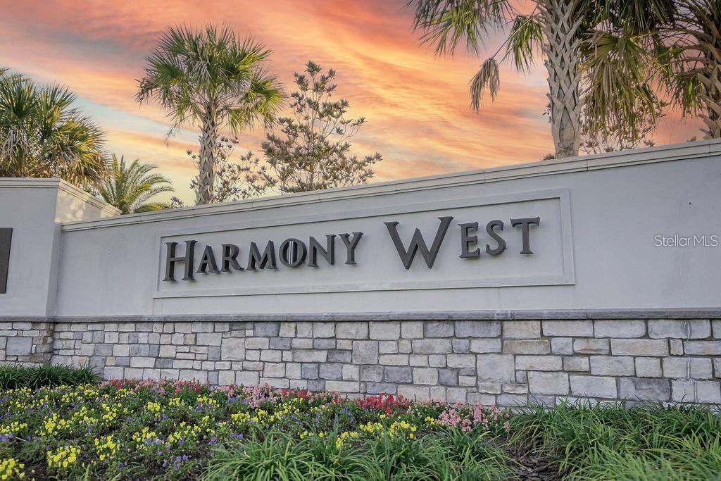 2937 Hooded Crane Cove Harmony, FL 34773 - Photo 3 of 58 a sign on the side of a building