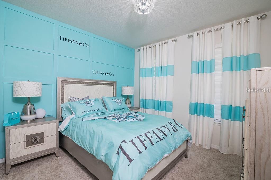 2937 Hooded Crane Cove Harmony, FL 34773 - Photo 39 of 58 a bedroom with a bed and a window