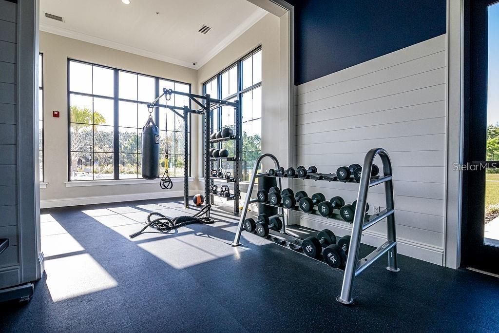 2937 Hooded Crane Cove Harmony, FL 34773 - Photo 56 of 58 a view of a room with gym equipment