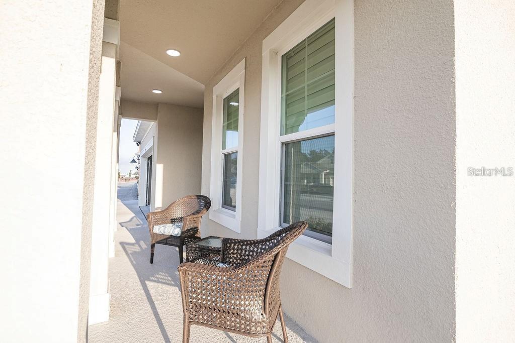 2937 Hooded Crane Cove Harmony, FL 34773 - Photo 7 of 58 a view of a living room with furniture and a window