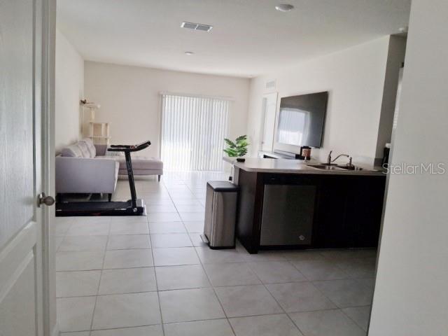 6772 Huntleigh Hammock Road St. Cloud, FL 34773 - Photo 10 of 14 a living room with furniture and window