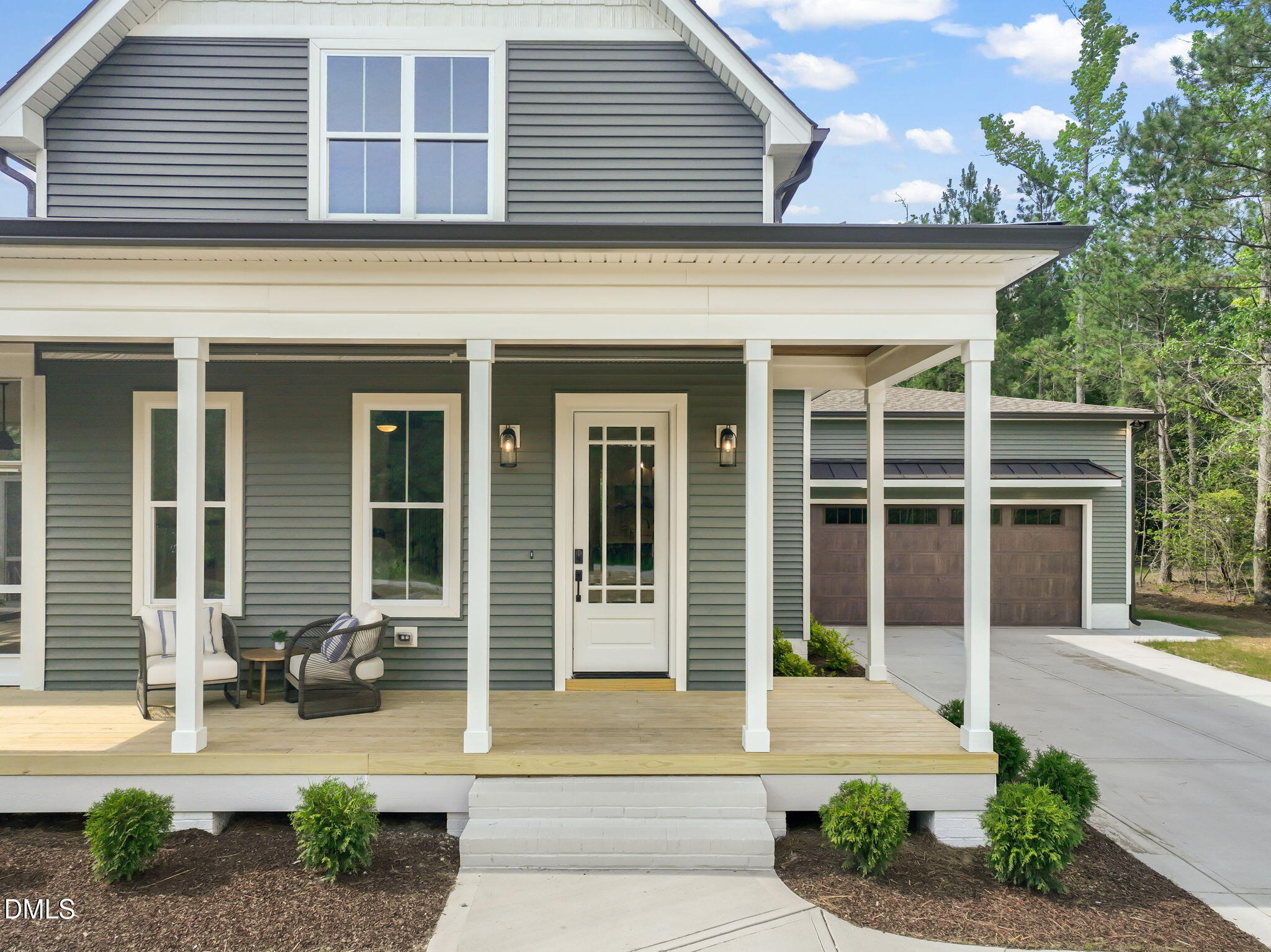 400 Pilot Ridge Road Zebulon, NC 27597 - Photo 3 of 51 a front view of a house with garden and porch