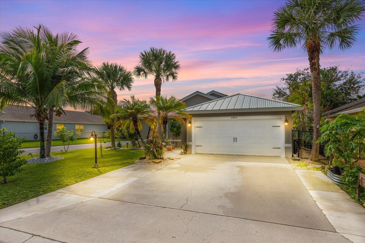 2484 Southwest Century Way Stuart, FL 34997 - Photo 46 of 56 Front yard At Twilight