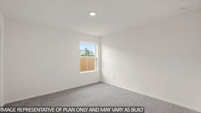 a view of an empty room and a window