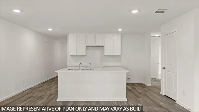 a room with a sink a washer and dryer