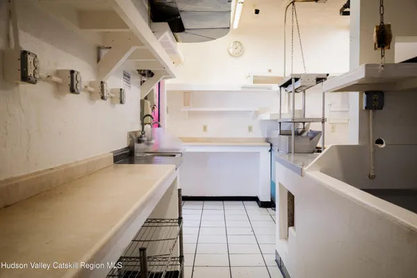 a kitchen with a stove and a refrigerator