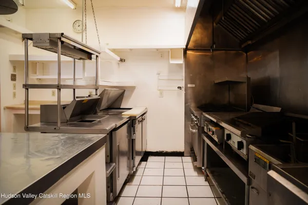 a kitchen with a sink appliances and cabinets