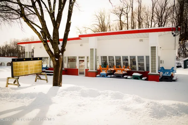 a view of outdoor space with parked cars