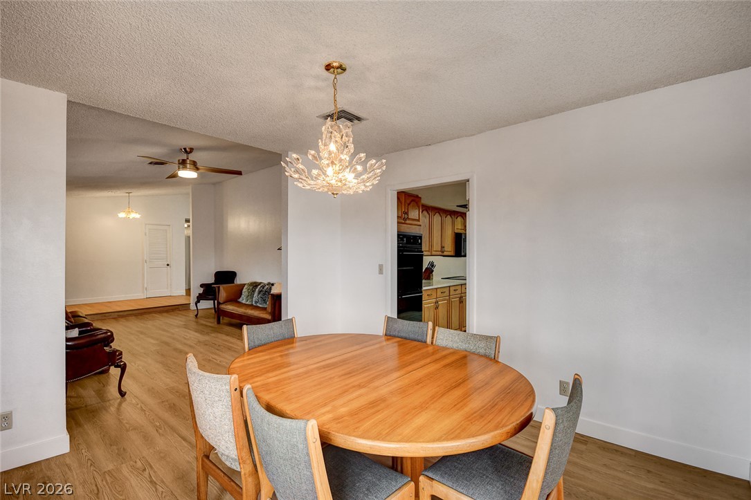 1401 Sharon Road Las Vegas, NV 89106 - Photo 28 of 73 An open dining area flows seamlessly into the main living spaces and nearby kitchen.
