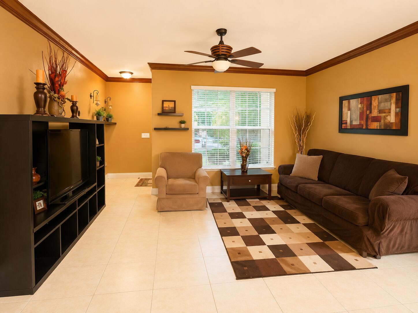 5880 West Sample Road, Unit 105 Coral Springs, FL 33067 - Photo 4 of 17 a living room with furniture and a flat screen tv