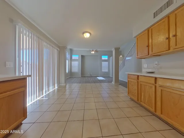 a large kitchen with stainless steel appliances granite countertop a large counter top and oven