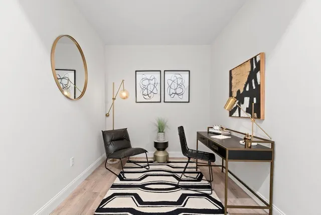 a view of a workspace with furniture