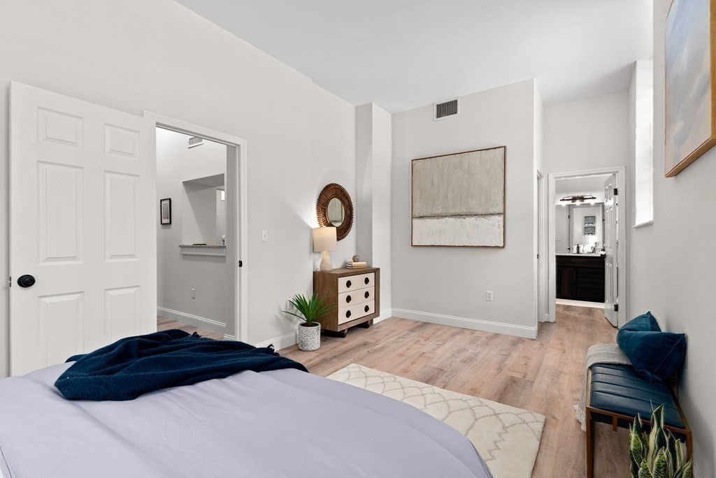 65 Glen Road, Unit H2 Brookline, MA 02445 - Photo 19 of 34 a bedroom with a bed and a dresser