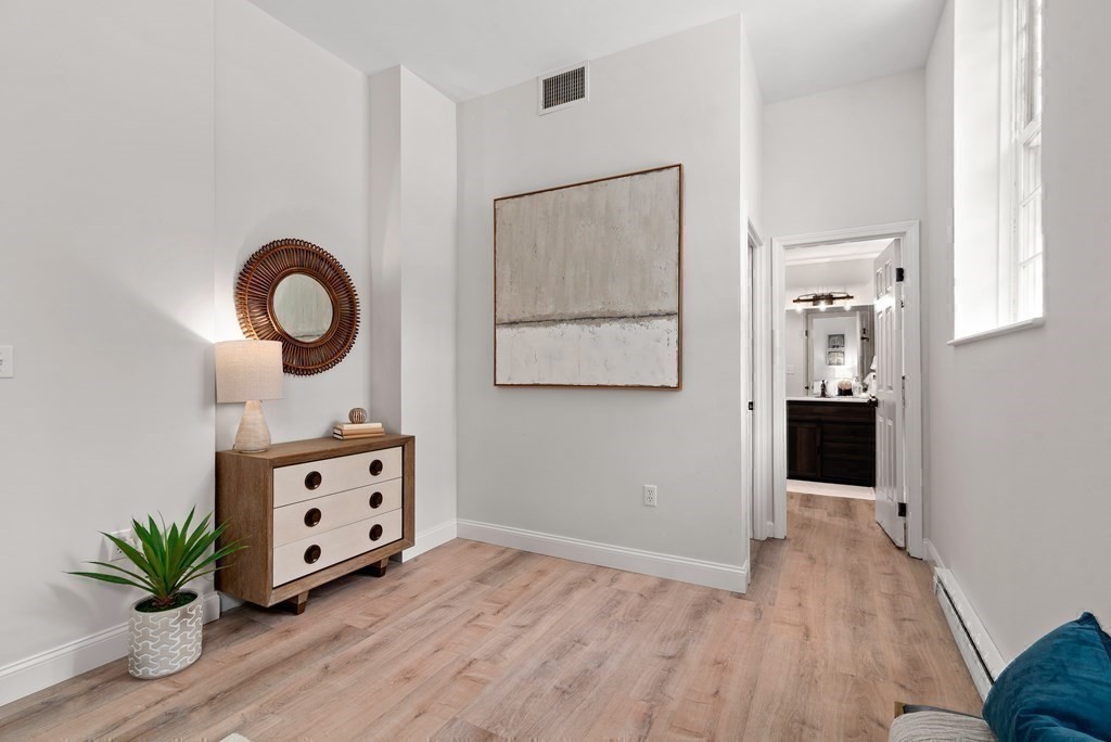 65 Glen Road, Unit H2 Brookline, MA 02445 - Photo 21 of 34 a view of entryway with wooden floor