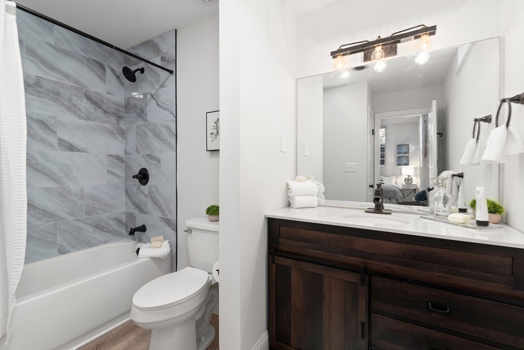 65 Glen Road, Unit H2 Brookline, MA 02445 - Photo 22 of 34 a bathroom with a sink a toilet and shower