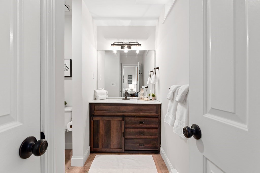 65 Glen Road, Unit H2 Brookline, MA 02445 - Photo 23 of 34 a bathroom with a sink and a mirror