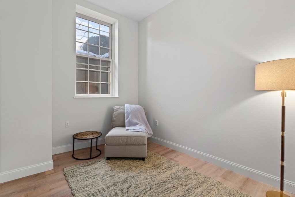 65 Glen Road, Unit H2 Brookline, MA 02445 - Photo 25 of 34 a living room with furniture and a window