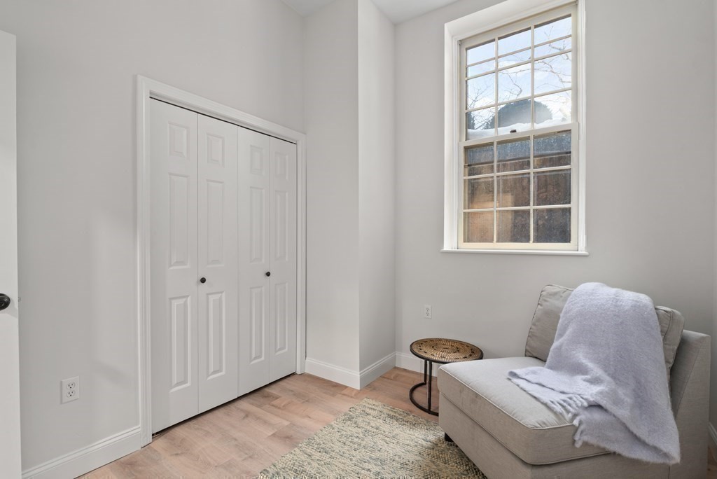 65 Glen Road, Unit H2 Brookline, MA 02445 - Photo 26 of 34 a room with furniture and a window