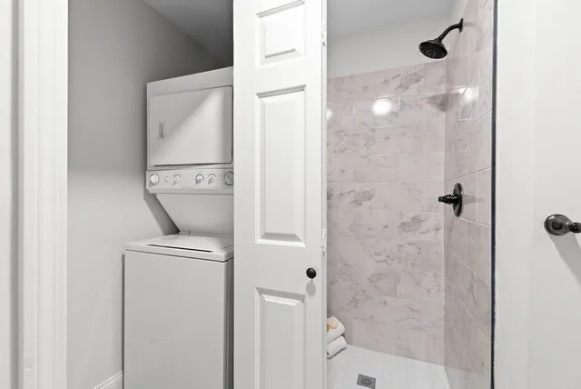 a bathroom with a shower and toilet