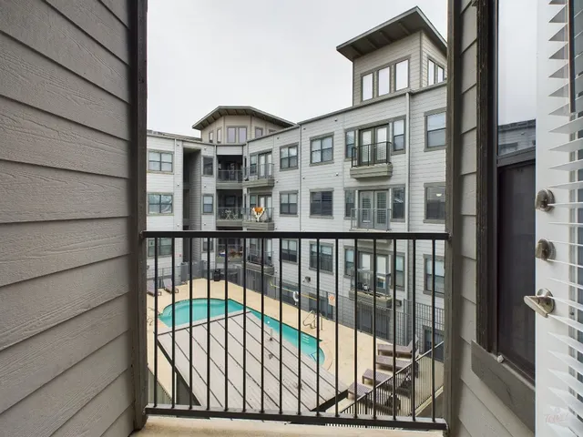 a view of a building from a balcony