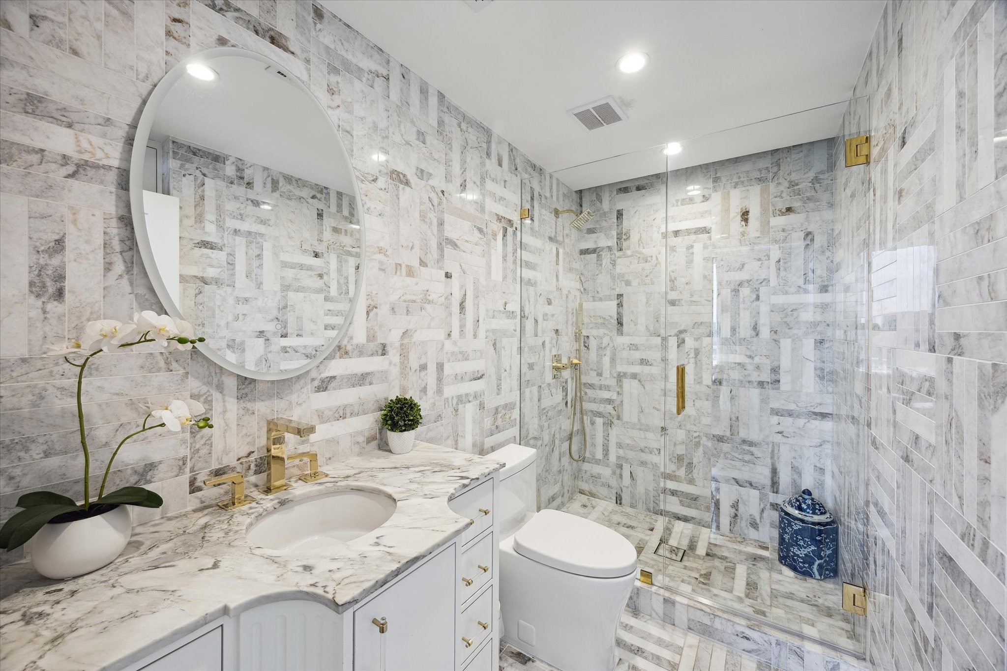 2701 Westheimer Road, Unit PHW Houston, TX 77098 - Photo 18 of 40 Designer Accents – Calcutta marble and polished brass secondary bath.