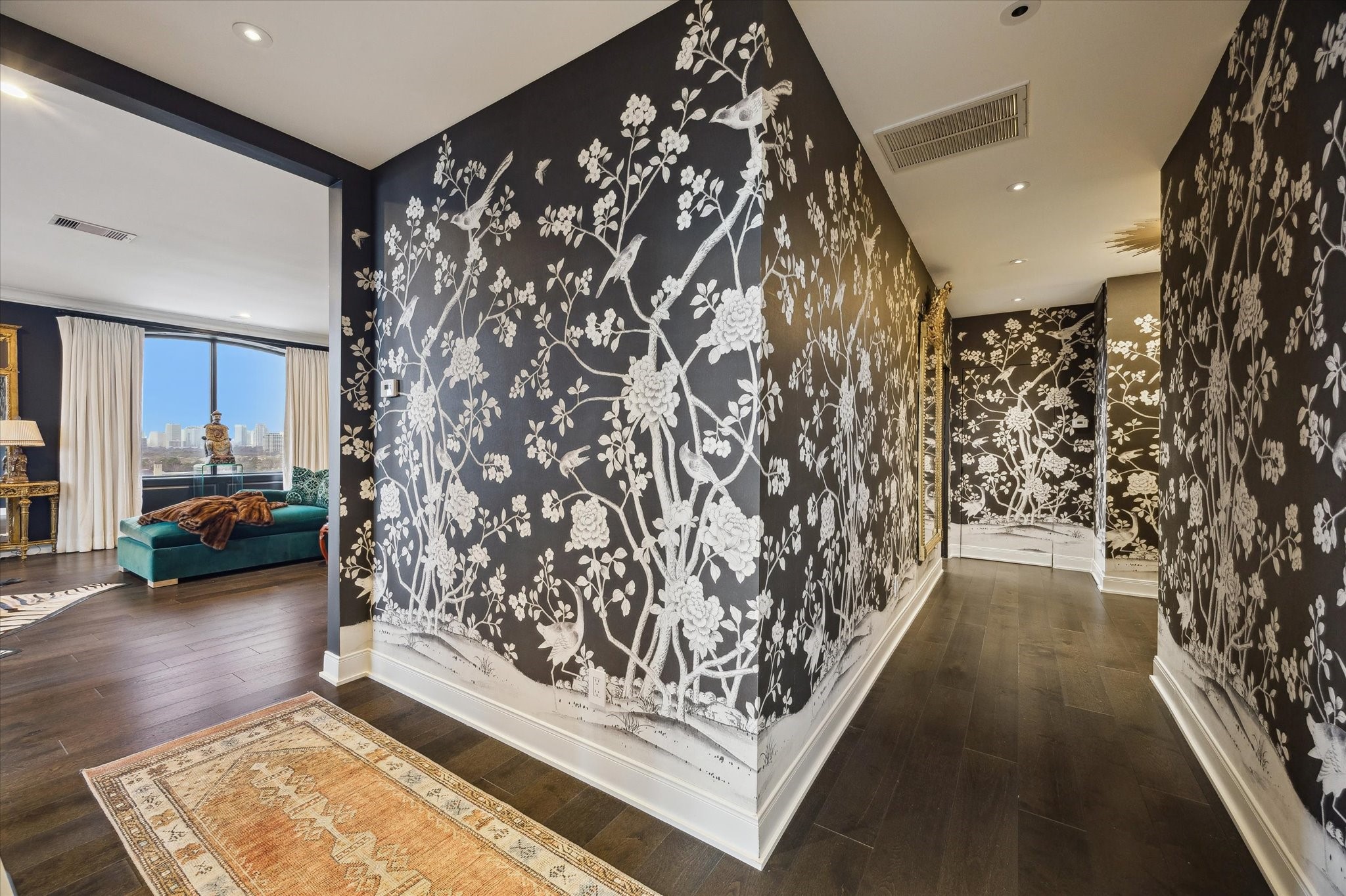 2701 Westheimer Road, Unit PHW Houston, TX 77098 - Photo 3 of 40 Interiors showcase engineered hardwoods, crown molding, carved custom door panels, 9’ ceilings, and recessed LED lighting throughout. Designer Accents – Elevated with Schumacher wallpaper in the foyer.