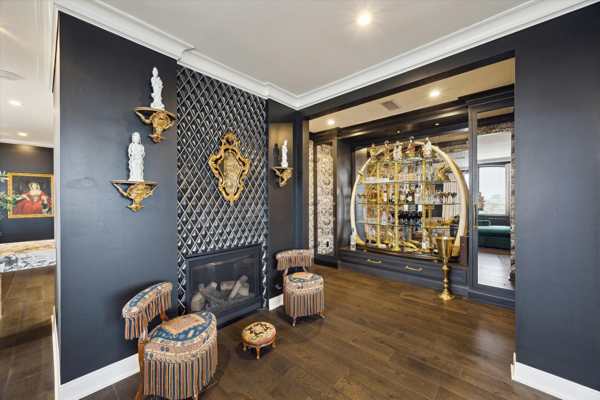 2701 Westheimer Road, Unit PHW Houston, TX 77098 - Photo 6 of 40 The living area features a gas fireplace and bar alcove with a built-in wine refrigerator.