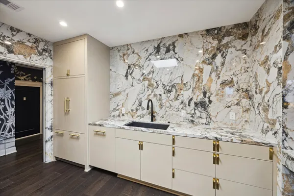 a kitchen with stainless steel appliances granite countertop a stove and a sink