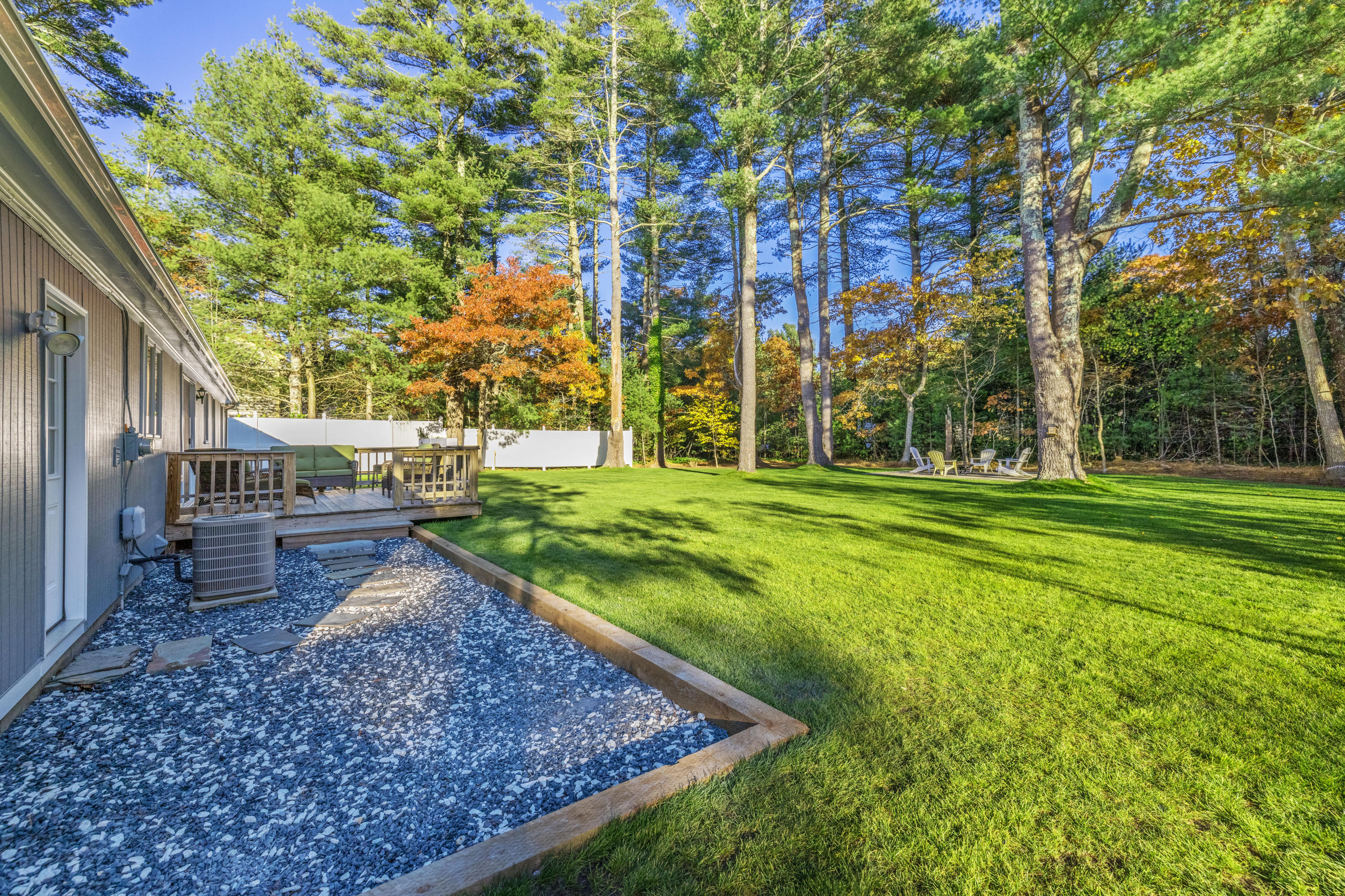 33 Cedric Road Centerville, MA 02632 - Photo 14 of 38 a view of a backyard with large trees