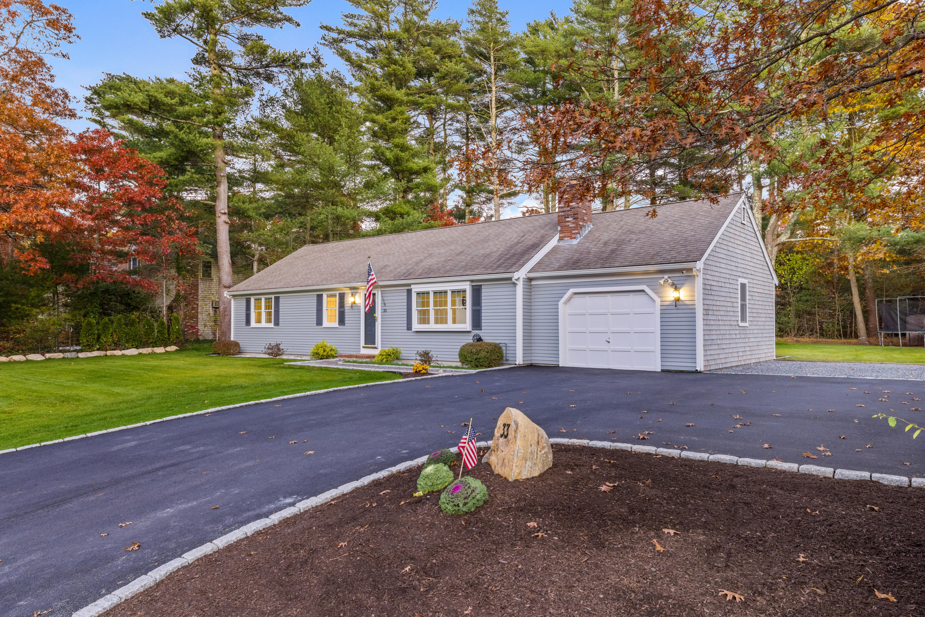 33 Cedric Road Centerville, MA 02632 - Photo 5 of 38 a front view of house with yard and green space