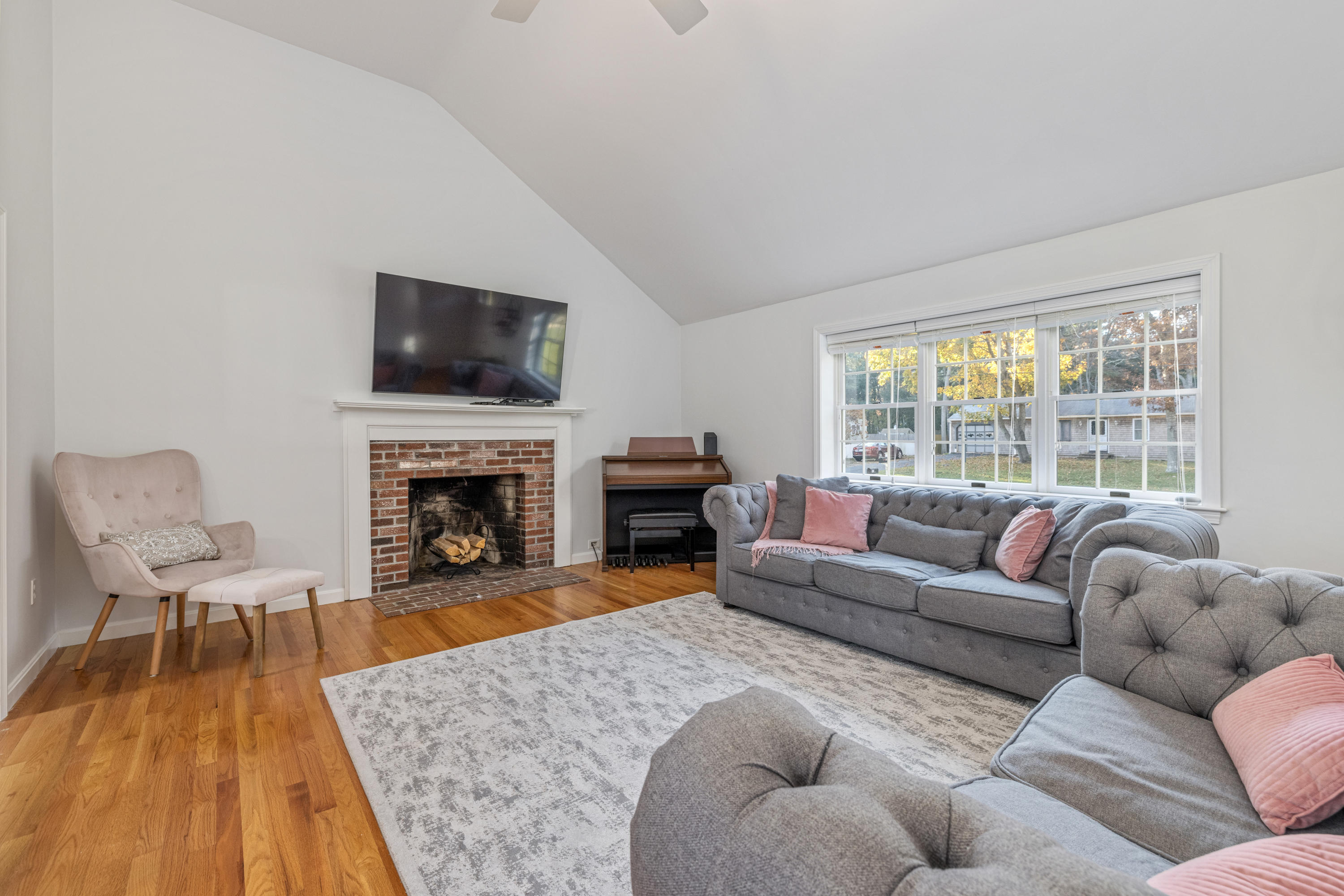 33 Cedric Road Centerville, MA 02632 - Photo 38 of 38 a living room with furniture and a fireplace
