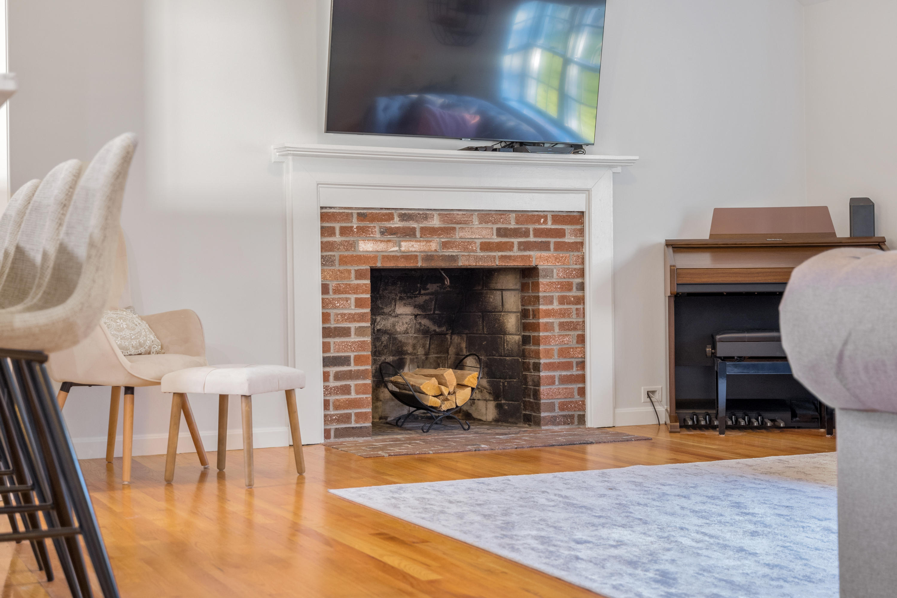 33 Cedric Road Centerville, MA 02632 - Photo 7 of 38 a living room with furniture and a fireplace
