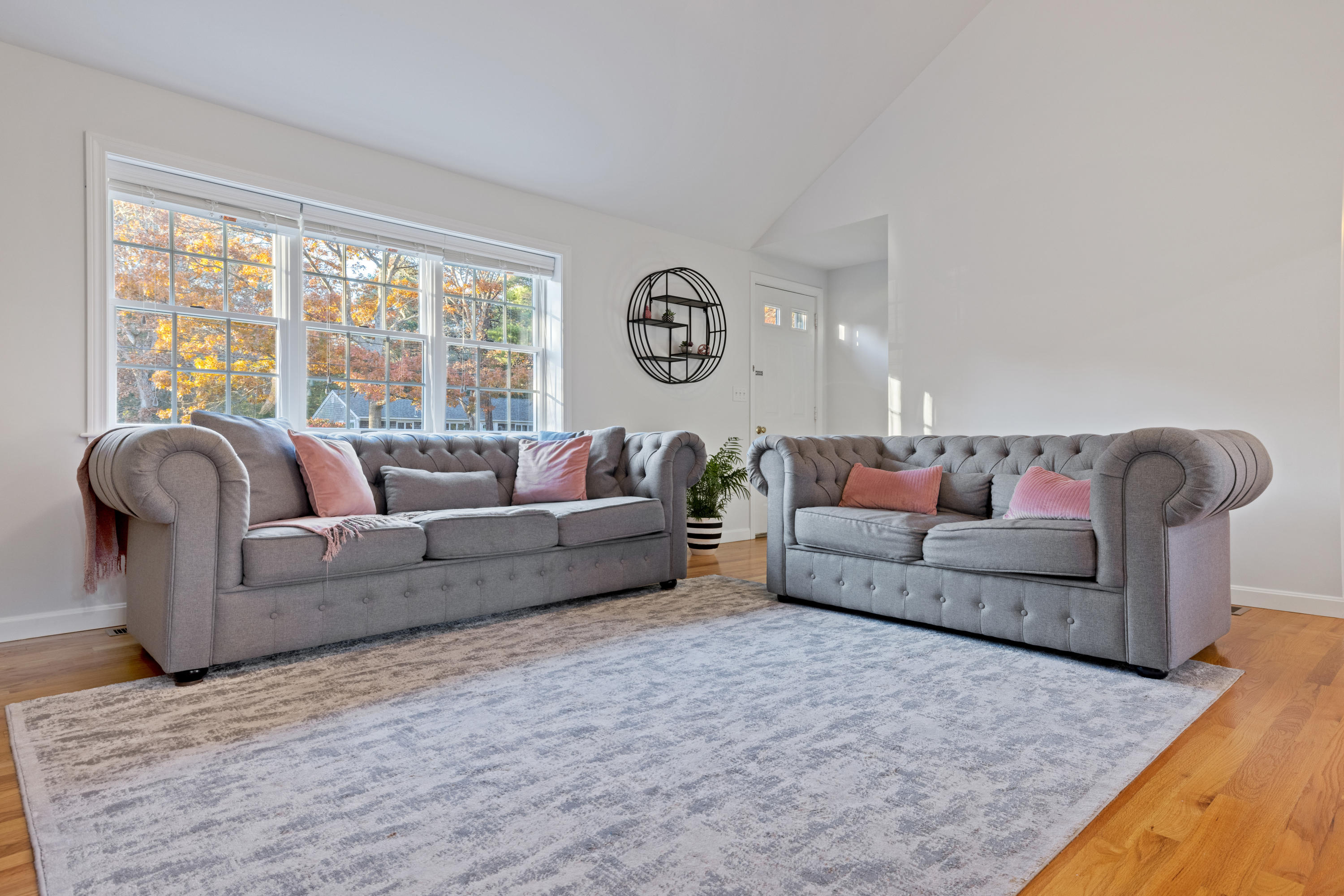 33 Cedric Road Centerville, MA 02632 - Photo 8 of 38 a living room with furniture and a large window