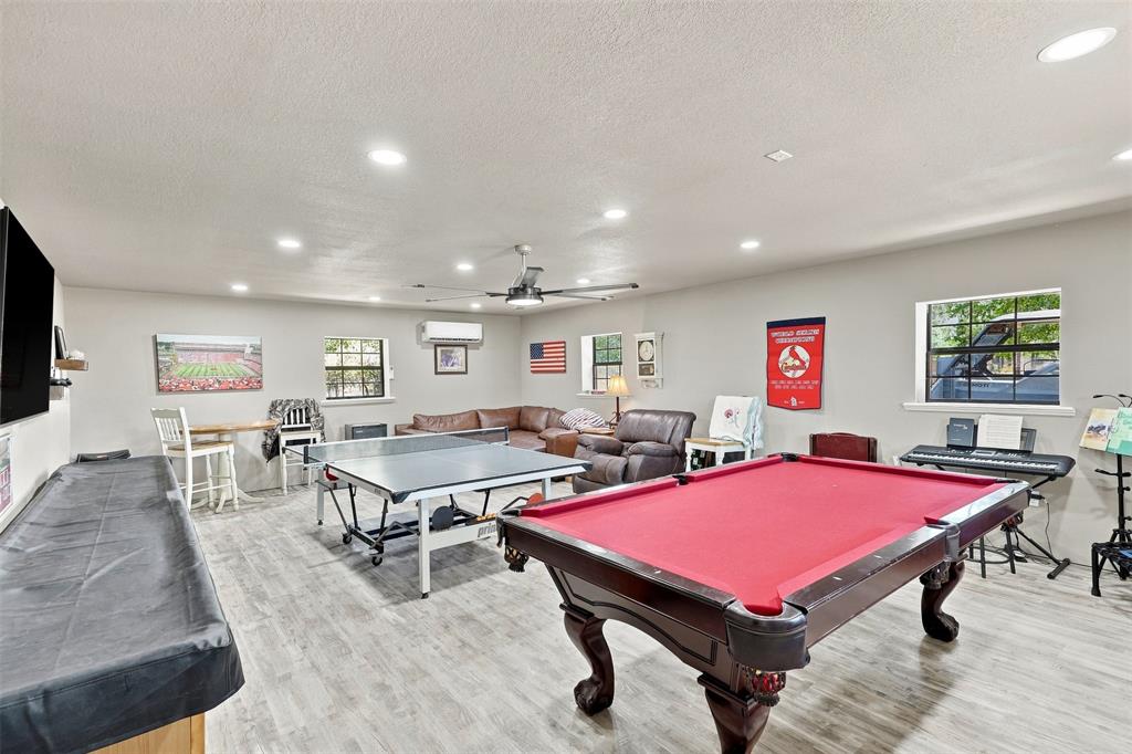 1000 Middleton Road Weatherford, TX 76088 - Photo 16 of 31 Spacious room featuring wood-finish flooring, recessed lighting, ceiling fan, and multiple windows