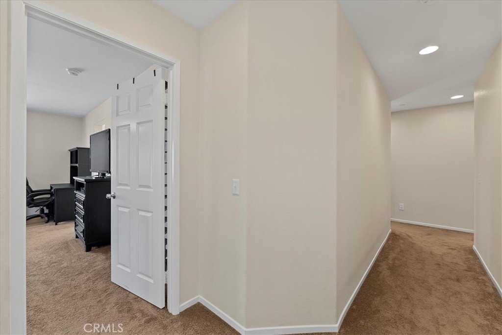 10969 Elkwood Circle Riverside, CA 92503 - Photo 14 of 42 a view of a hallway with closet and a living room