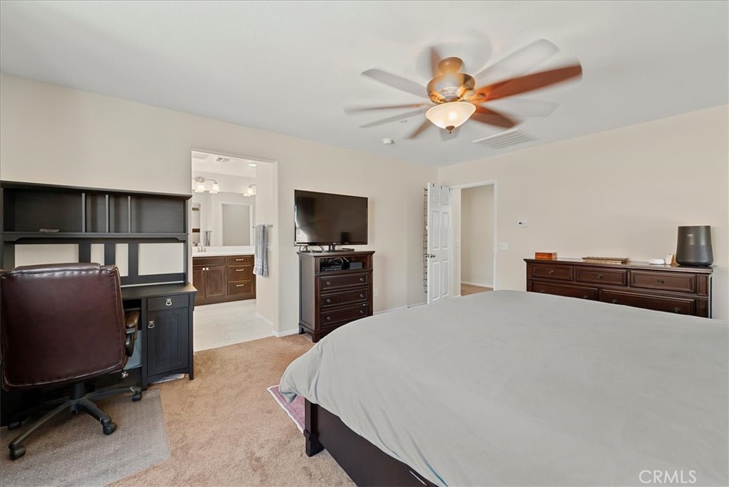 10969 Elkwood Circle Riverside, CA 92503 - Photo 16 of 42 a bed room with a bed and a television