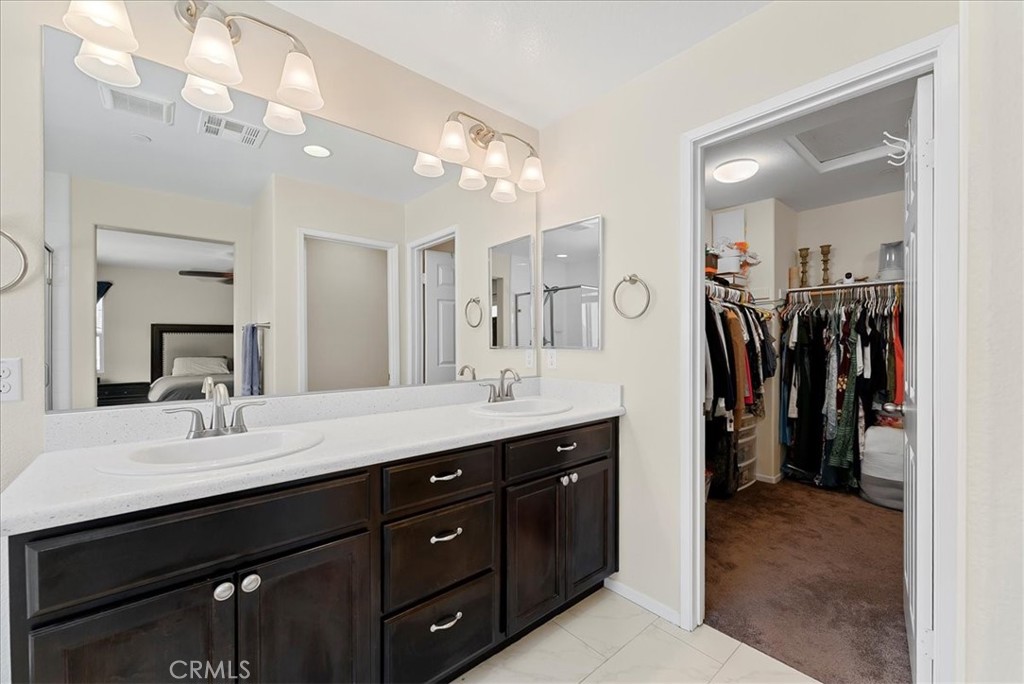 10969 Elkwood Circle Riverside, CA 92503 - Photo 19 of 42 a bathroom with a double vanity sink mirror and double