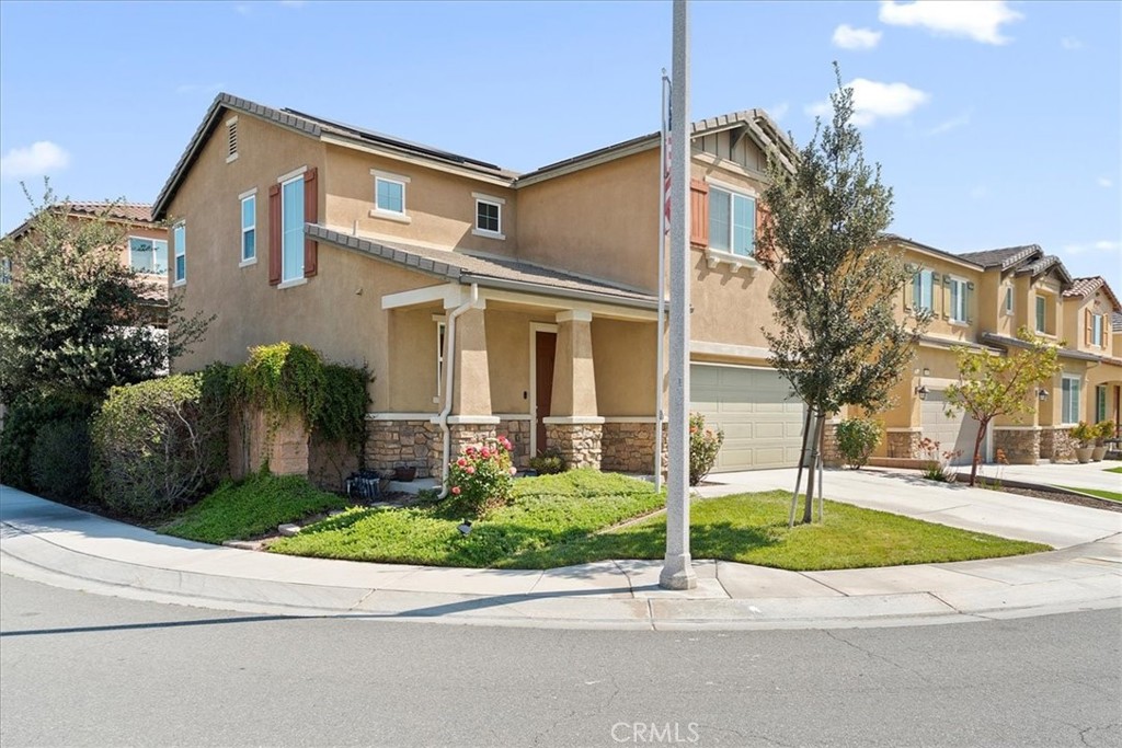 10969 Elkwood Circle Riverside, CA 92503 - Photo 2 of 42 a front view of a house with a yard and garage