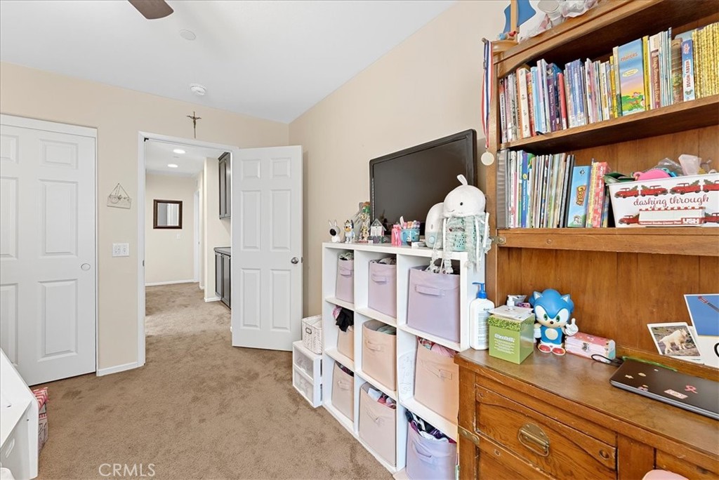 10969 Elkwood Circle Riverside, CA 92503 - Photo 26 of 42 a hallway with cabinets and wooden floor