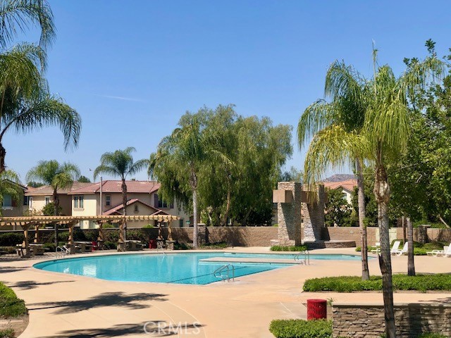 10969 Elkwood Circle Riverside, CA 92503 - Photo 32 of 42 a front view of a house with a yard and palm trees