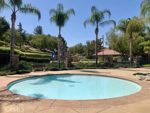 10969 Elkwood Circle Riverside, CA 92503 - Photo 34 of 42 a view of a swimming pool with a yard