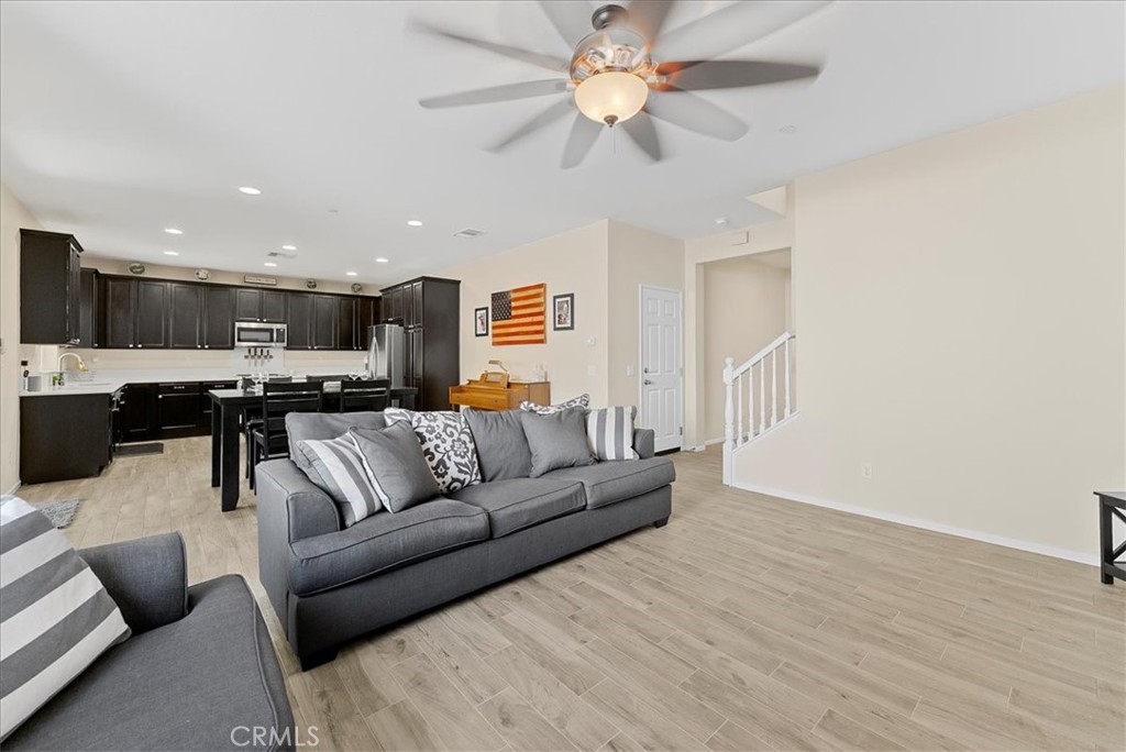 10969 Elkwood Circle Riverside, CA 92503 - Photo 5 of 42 a view of a living room kitchen and a wooden floor